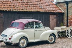 An old vehicle and farm wagon