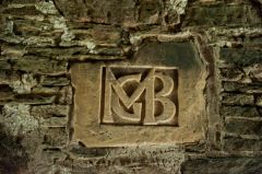 Initials above fireplace