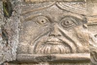 Barfreston, St Nicholas Church, Carved face, north door