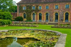 A lovely lily pond stands before the old stable block