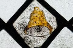 Medieval glass of a bell, chancel