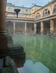 Steam rises from the baths