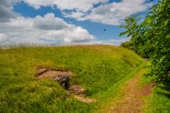 The side of the barrow showing a burial chamber entrance
