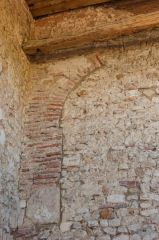 Ruined brick arch, east wall