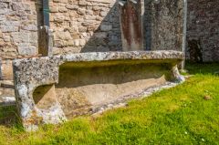 A stone coffin outside the porch