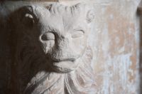 Lion carving on font