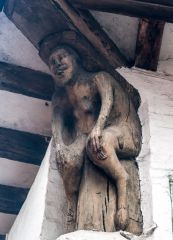 Carved wooden figure on the house exterior