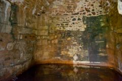 The back wall of the well