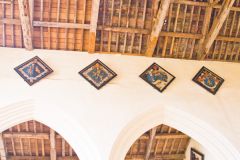 Dryden hatchments over the nave arcade