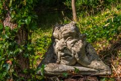 A funny statue in the garden woodland