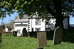 The churchyard and pub (c) Tony Atkin