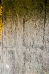 A very worn sword carving