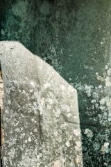 A very worn cross symbol