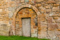 A blocked Romanesque doorway arch