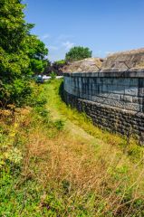 Defensive earthwork ditch outside the walls