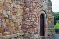 West entrance with medieval masonry