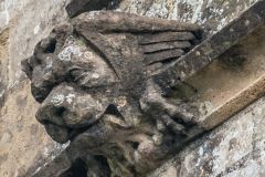 Carved lion's head, south wall