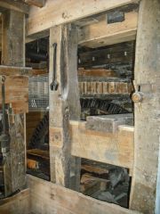 Large geared wheels driving the grind stones