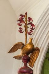 The gilded top to the font cover