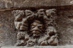 Green Man carving on the font