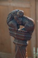 Bench end beast carving