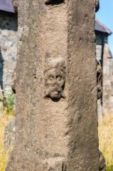 Carved head on the cross shaft