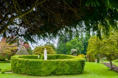 A circular hedge and statue