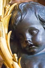 A demure cherub and gilding