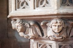Carved heads on the pulpit