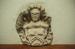 An angel holding Evesham Abbey arms