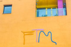 The museum logo and a flat balcony above