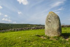 A standing stone overlooks the loch