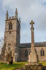 The churchyard cross and west tower