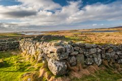 The ruined walls of the house