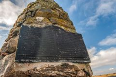 The plaque on the memorial cairn