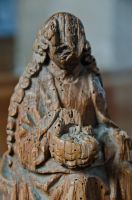 Seated figure carving