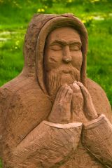 Modern sculture of a monk praying