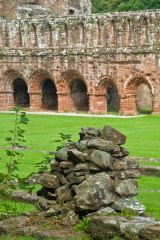 Abbey cloister and church beyond