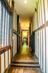 There are narrow timber-framed passageways throughout