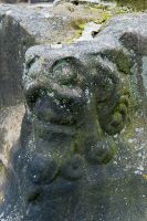 Gawsworth, St James Church, Carved head on cross base