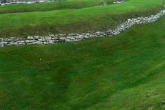 Exterior ditch and stone wall aroud the broch