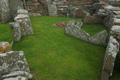 Stone partition walls divide the interior