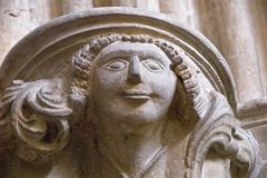 Carved corbel head of a woman