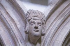 Carved head between nave arches