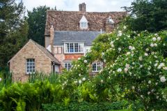 The manor glimpsed from the garden