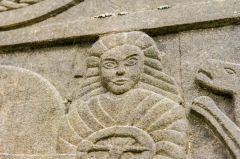 Female figure on the reverse face of the cros