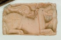 Norman winged beast carving