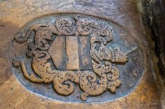 Heraldic coat of arms on a grave slab