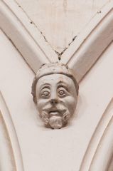 A humorous carved head in the nave arcade