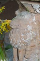 Lion carving on font